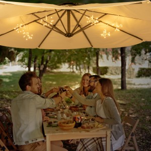 Group of young friends toasting with red wine at Thanksgiving table