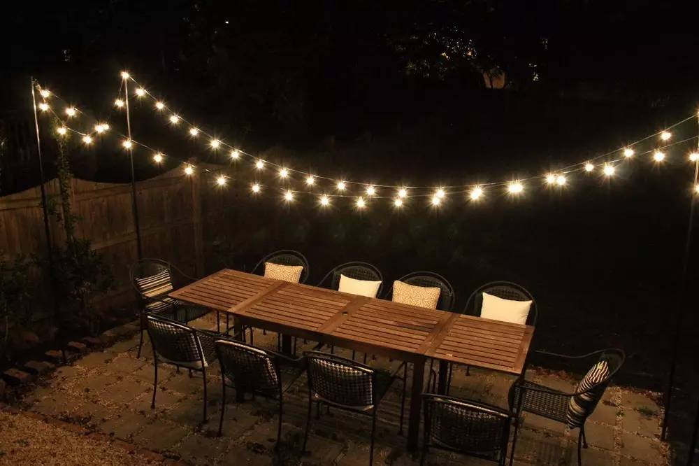 backyard string lights above table