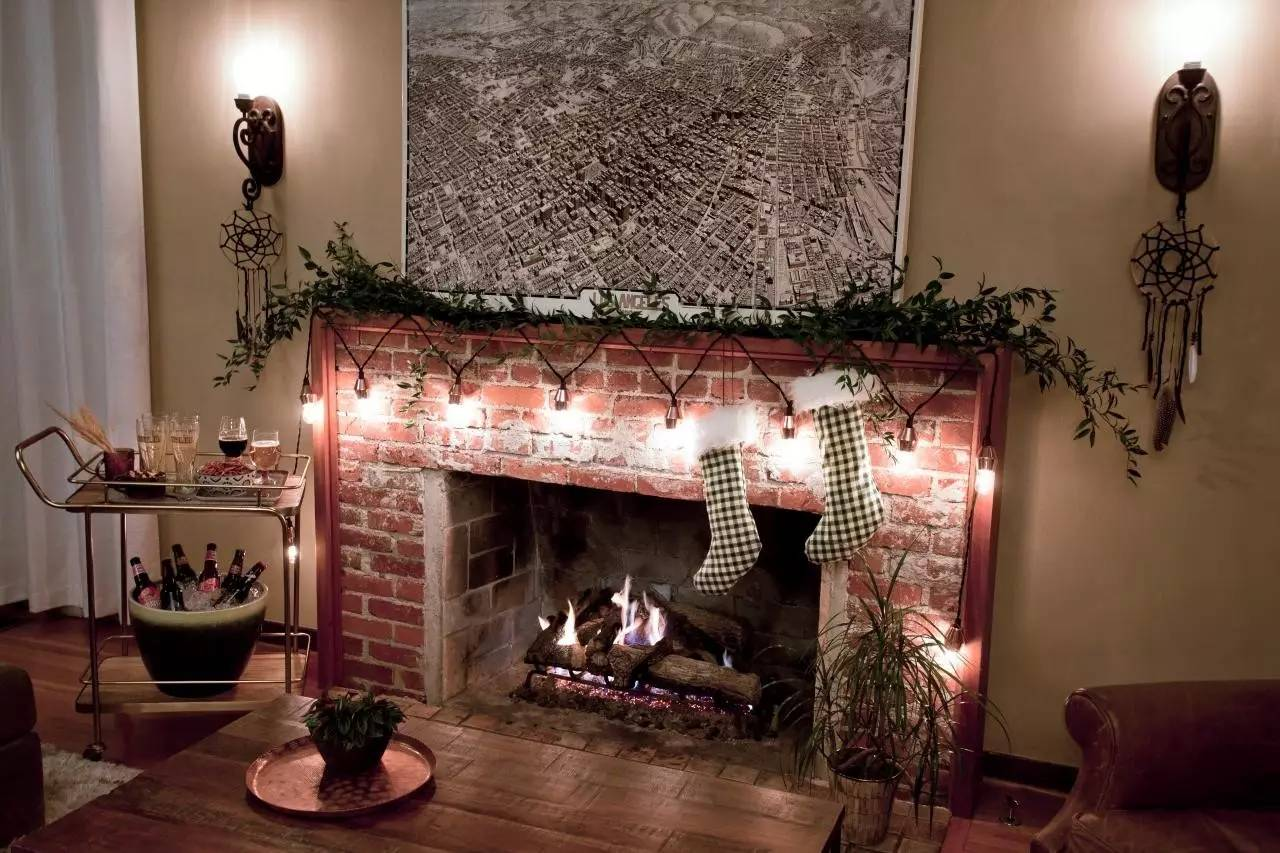 decorate the fireplace with light strings