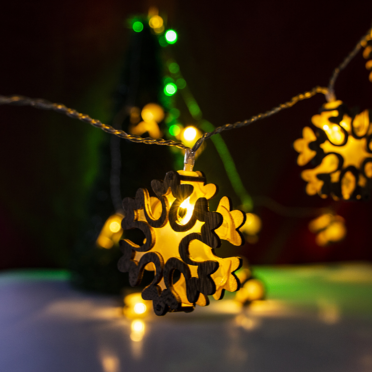 wooden snowflake string lights